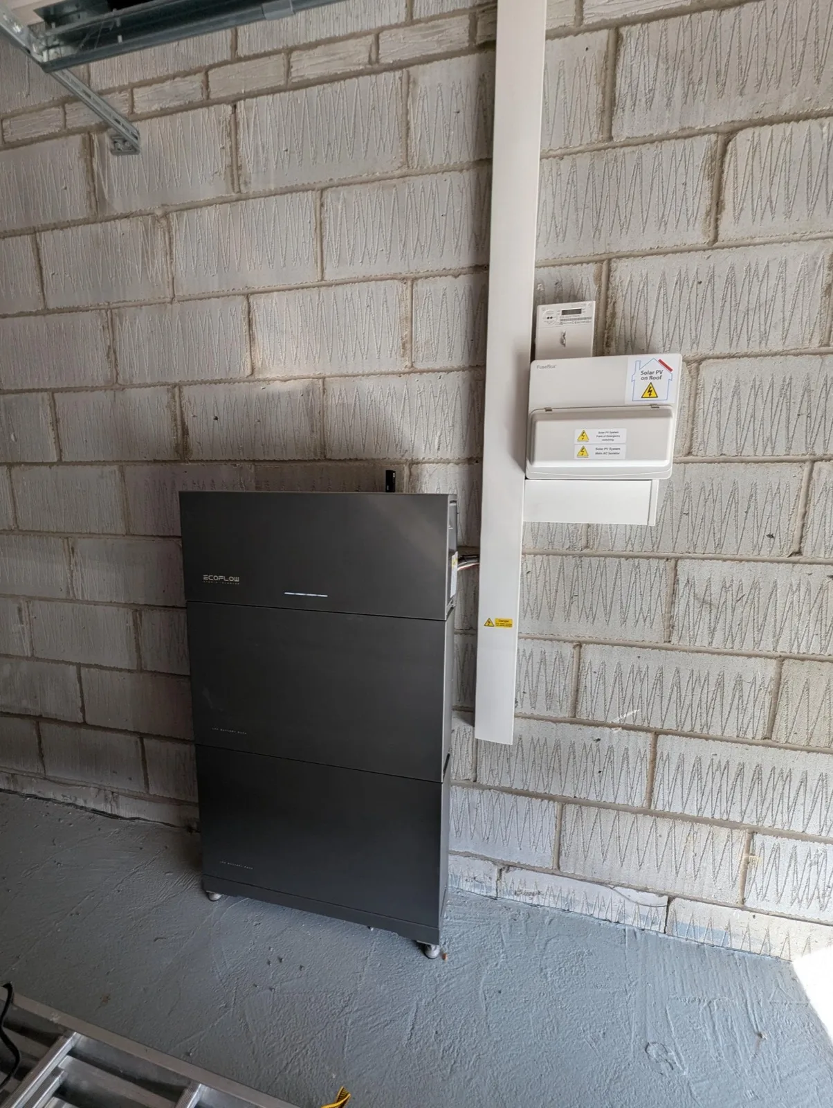 EcoFlow PowerOcean LFP battery stack installed in a customer's garage by Blue Electrics